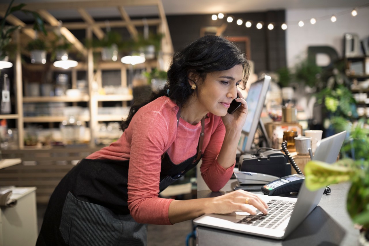Woman researching Manulife Singapore website and contacting via phone