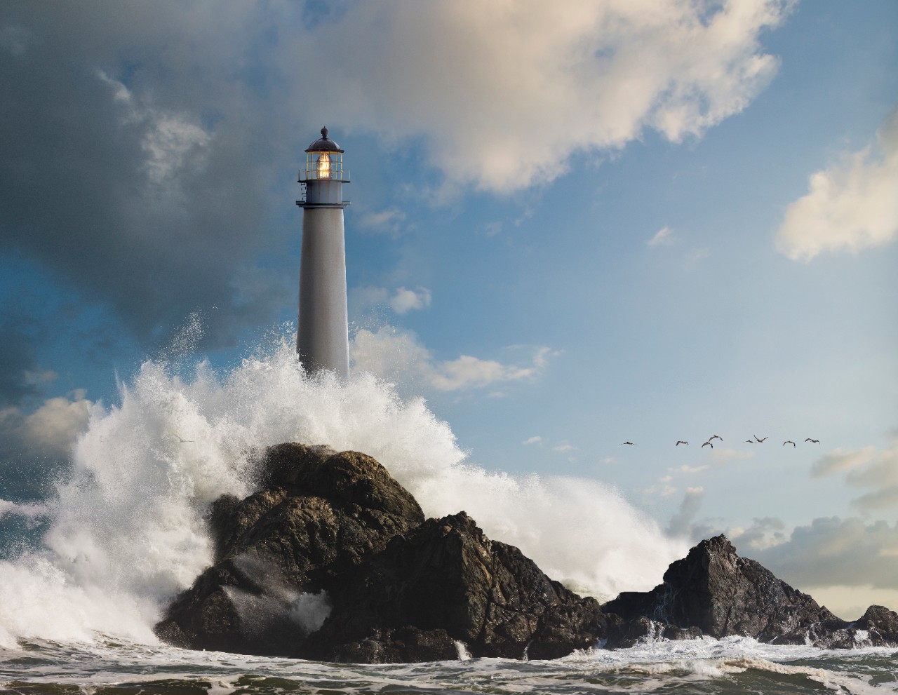 Waves crashing on lighthouse and rock formations